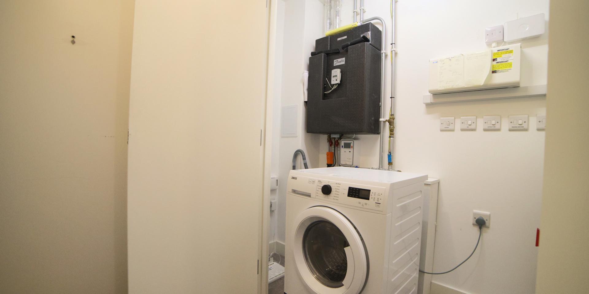 The washer/dryer is located in one of the hall cupboards