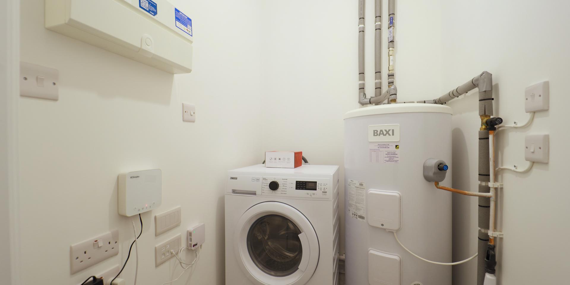 The washer dryer is located in the hallway cupboard