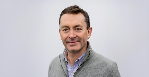 Headshot of David Matthews, member of Hightown's Board. He is wearing a grey quarter zip jumper and lilac shirt. Headshot of David Matthews, member of Hightown's Board. He is wearing a grey quarter zip jumper and lilac shirt.