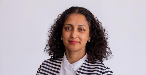 Headshot of Charmaine De Souza - member of the board at Hightown. She is wearing a black and white stripped cardigan and has brown curly hair and brown eyes. Headshot of Charmaine De Souza - member of the board at Hightown. She is wearing a black and white stripped cardigan and has brown curly hair and brown eyes.