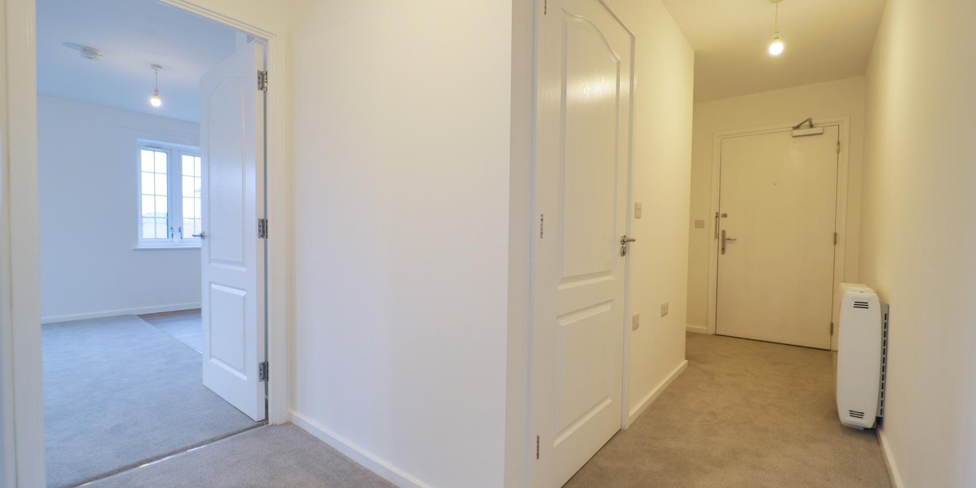 The hallway is carpeted