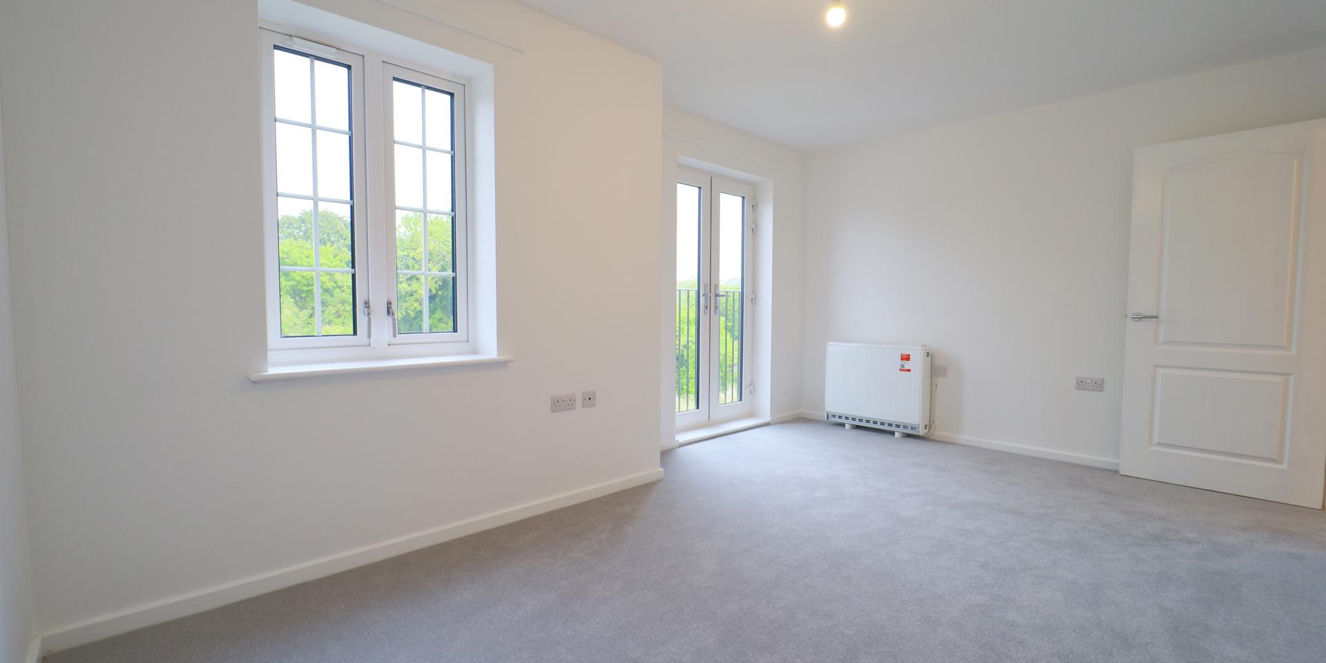 Bedroom 1 has a Juliette balcony and large window