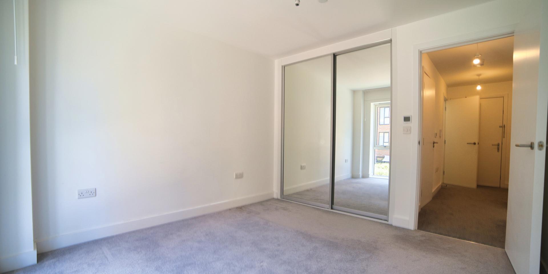 There is a built-in double mirrored wardrobe in the bedroom
