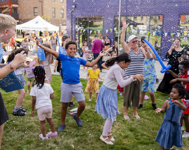 Children smiling and laughing at summer event