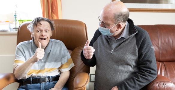 Hightown service user with Support Worker giving the thumbs up Hightown service user with Support Worker giving the thumbs up