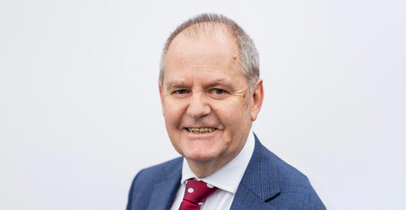 A headshot of the director of finance, David Skinner, smiling at the camera. He is wearing a blue blazer, white shirt and a red and white dotted tie. A headshot of the director of finance, David Skinner, smiling at the camera. He is wearing a blue blazer, white shirt and a red and white dotted tie.